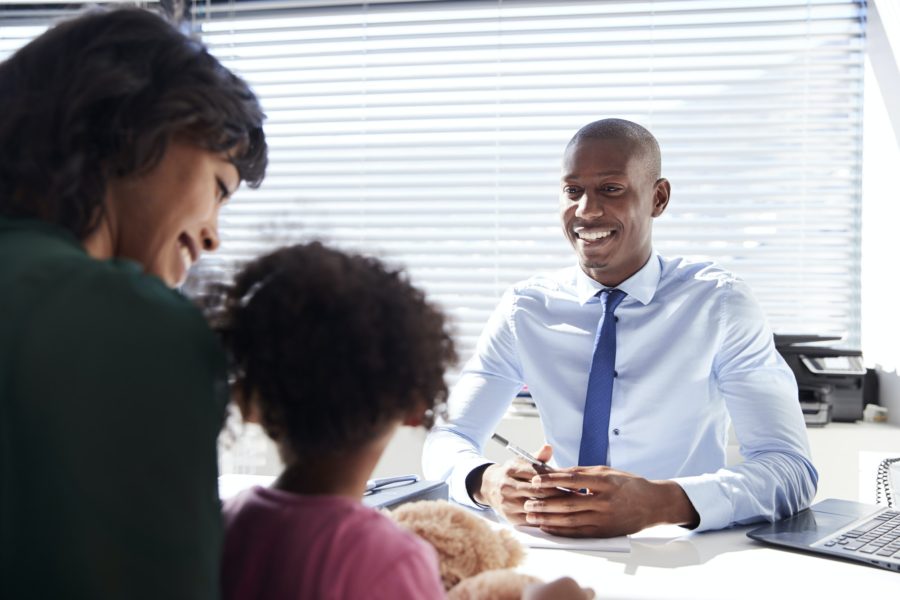 Realtor having Real Estate Agent Consultation with Mother and Daughter